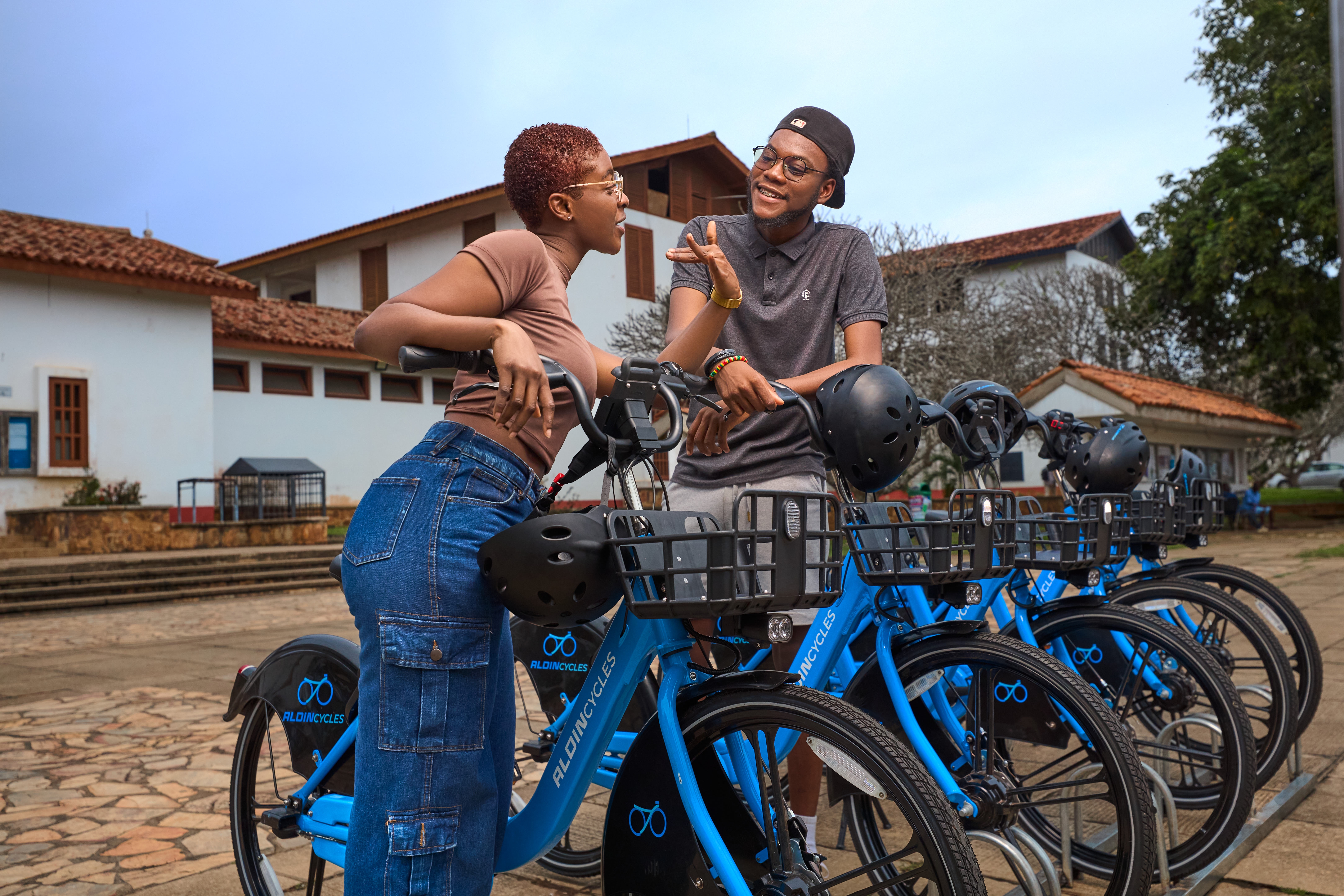 A guy and girl discussing on bikes