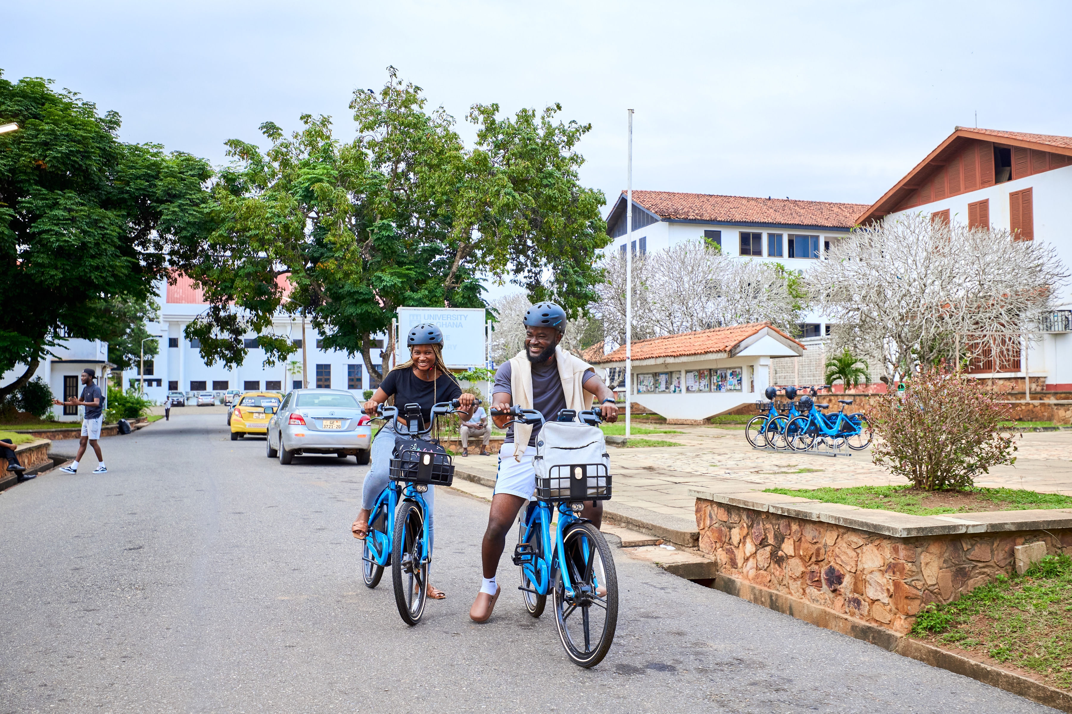 A guy and a girl riding a bike